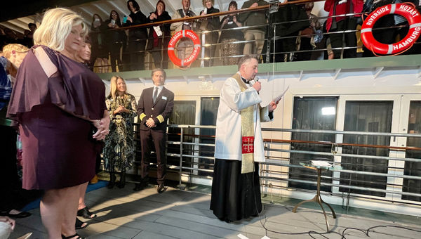 In a ceremony in Budapest, a local priest blesses the Riverside Mozart alongside the ship's godmother, Tiffany Hines of Global Escapes in Athens, Ga.