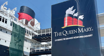 Workers do painting touch-ups on the Queen Mary.